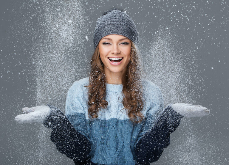Cute girl with snowflakes having a good time